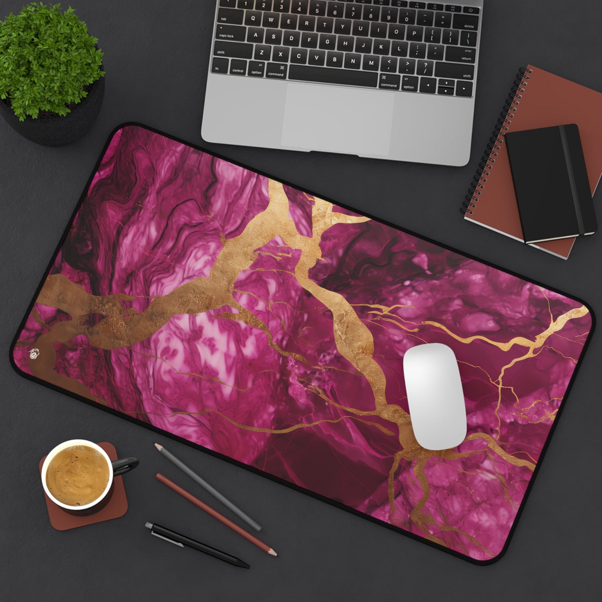 Fuchsia Marble with Gold Accents xxl mouse pad of size 12 by 22 inches displayed on a desk