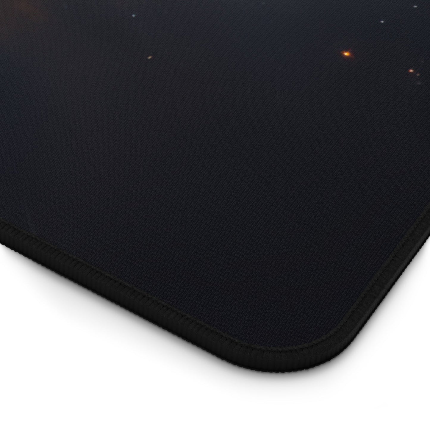 Close-up view of the front of the Vivid Orange Nebula Imagery xxl mouse pad