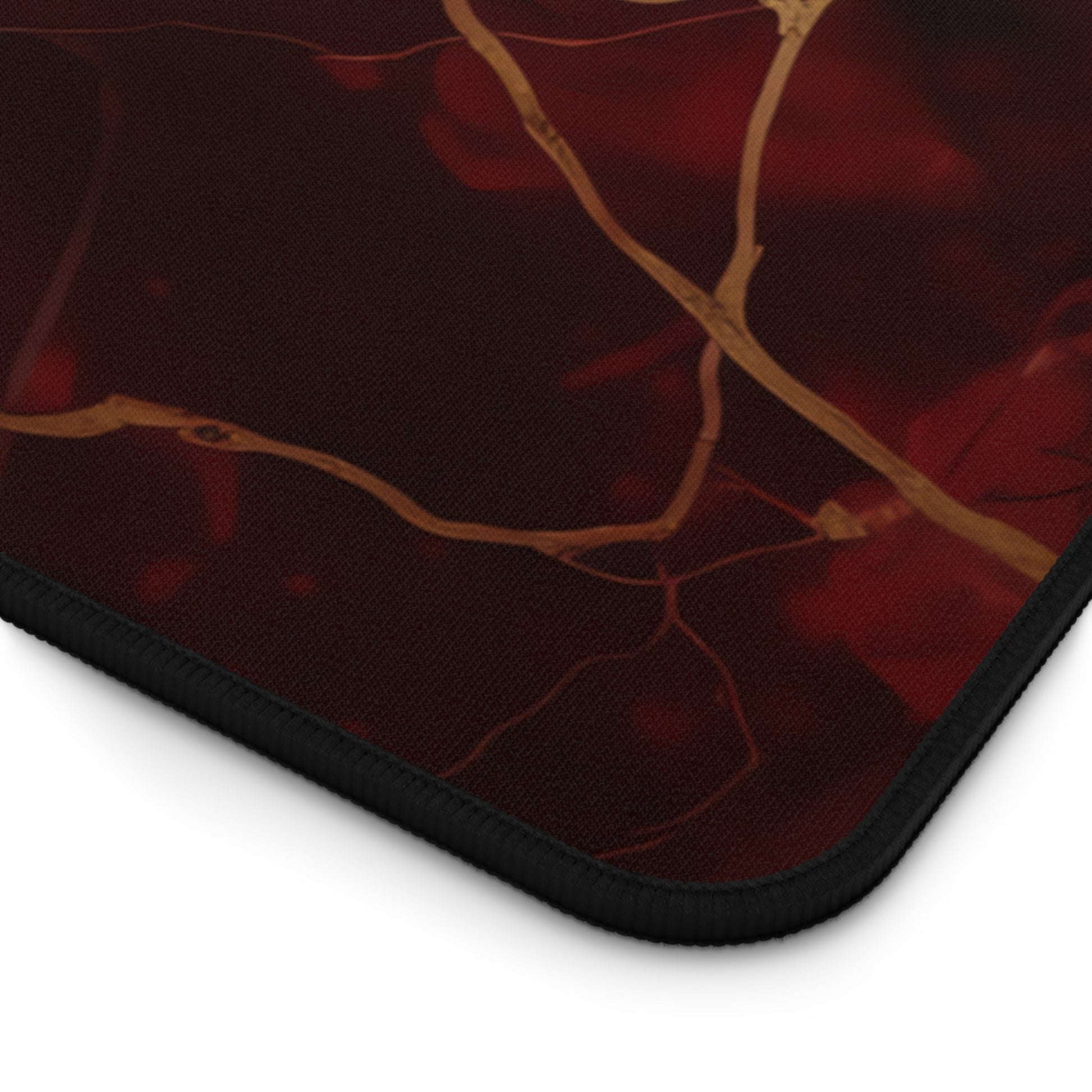 Close-up view of the front of the Rich Red, Marbled, Gold Detailing xxl mouse pad