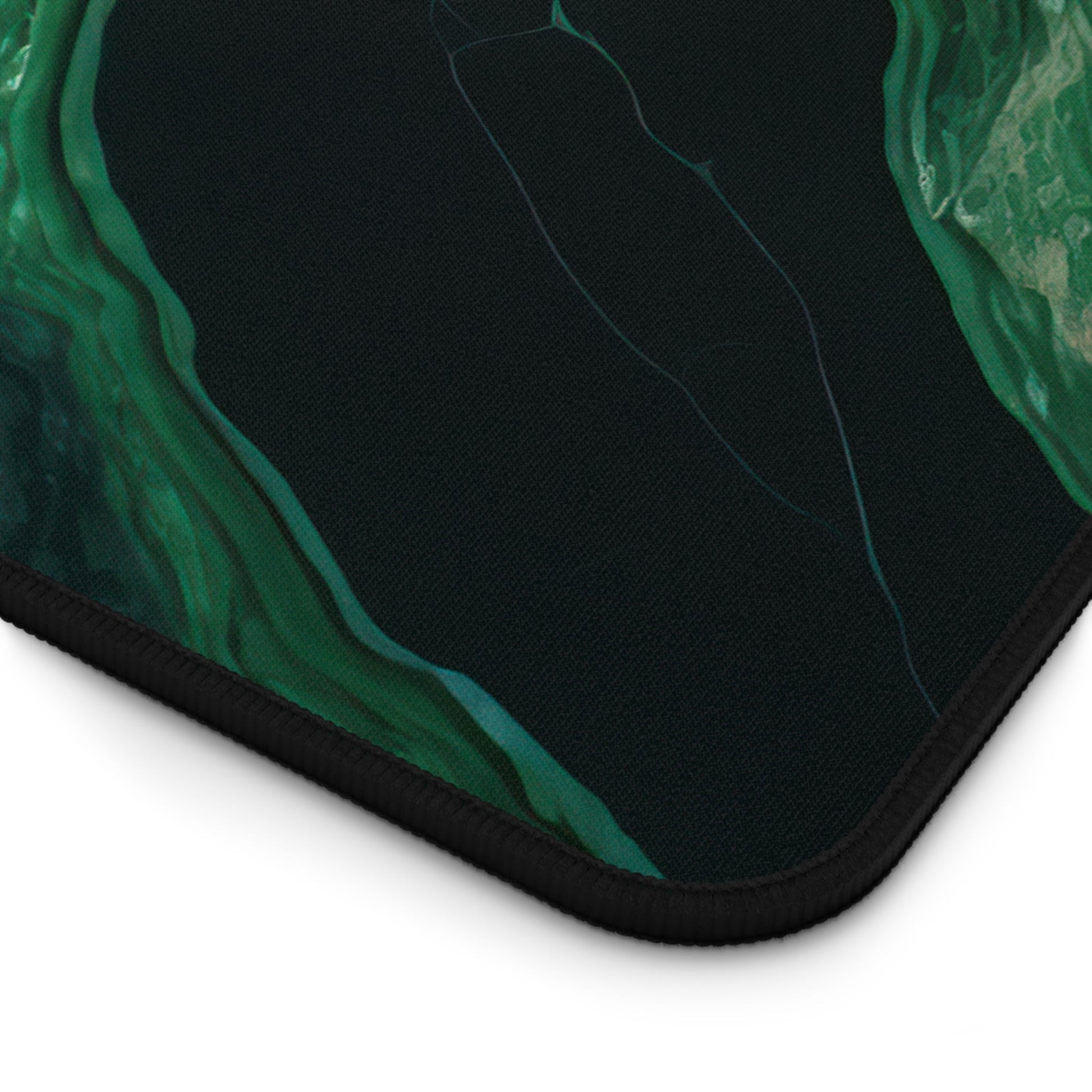 Close-up view of the front of the Elegant Emerald Green Marble xxl mouse pad