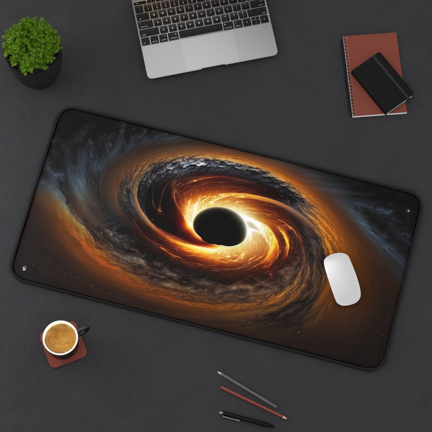 Galactic Black Hole Imagery xxl mouse pad of size 15 by 31 inches displayed on a desk