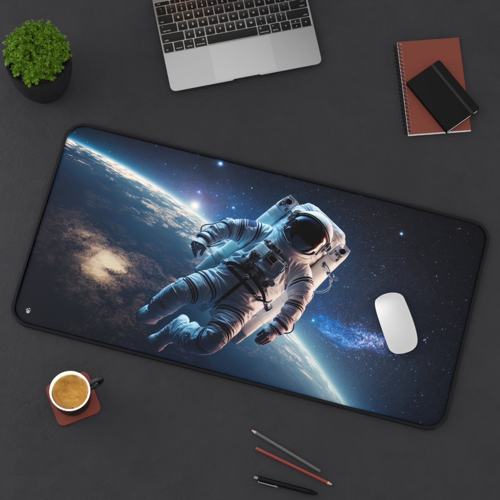 Starry Sky Astronaut Exploration xxl mouse pad of size 15 by 31 inches displayed on a desk