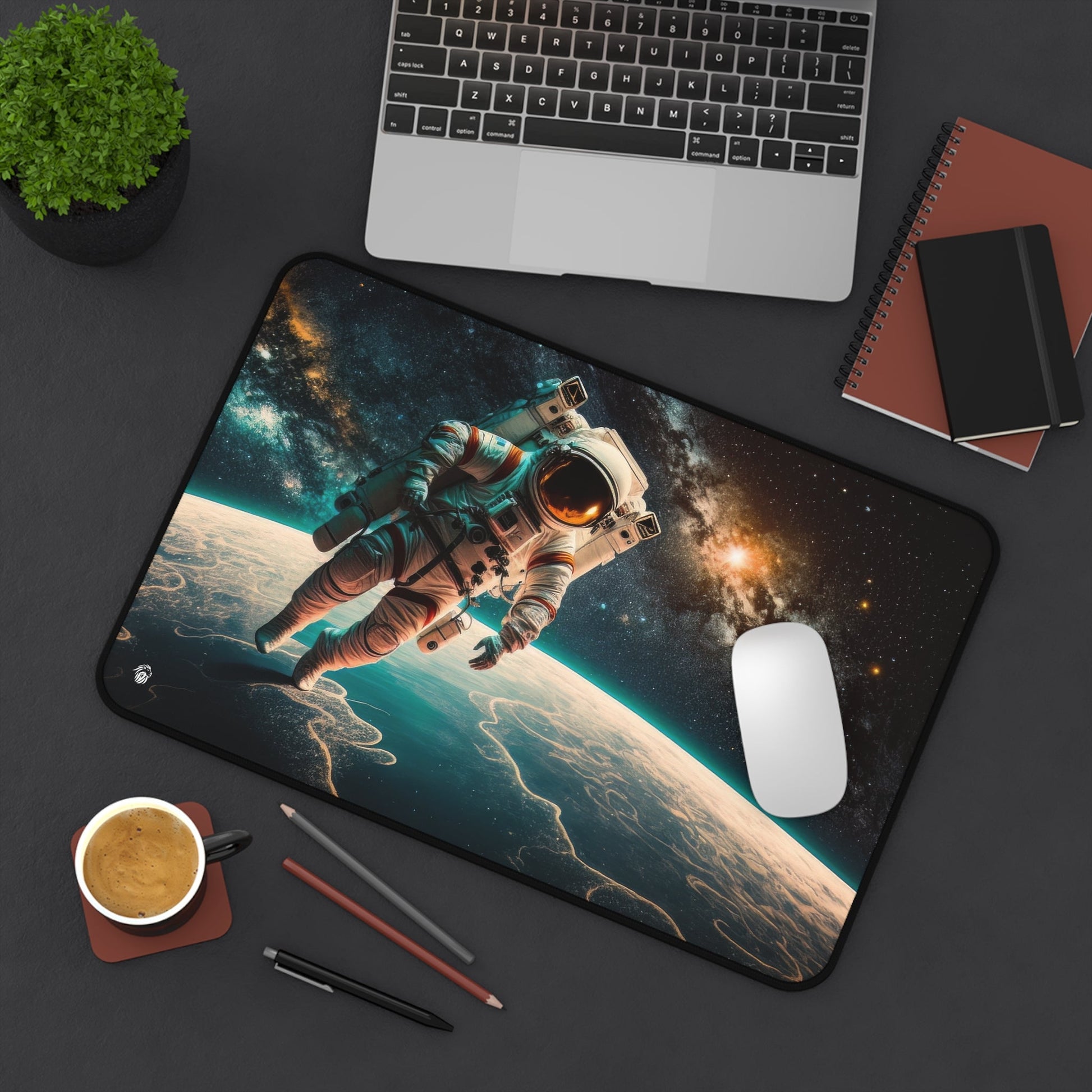 Astronaut in Space xxl mouse pad of size 12 by 18 inches displayed on a desk