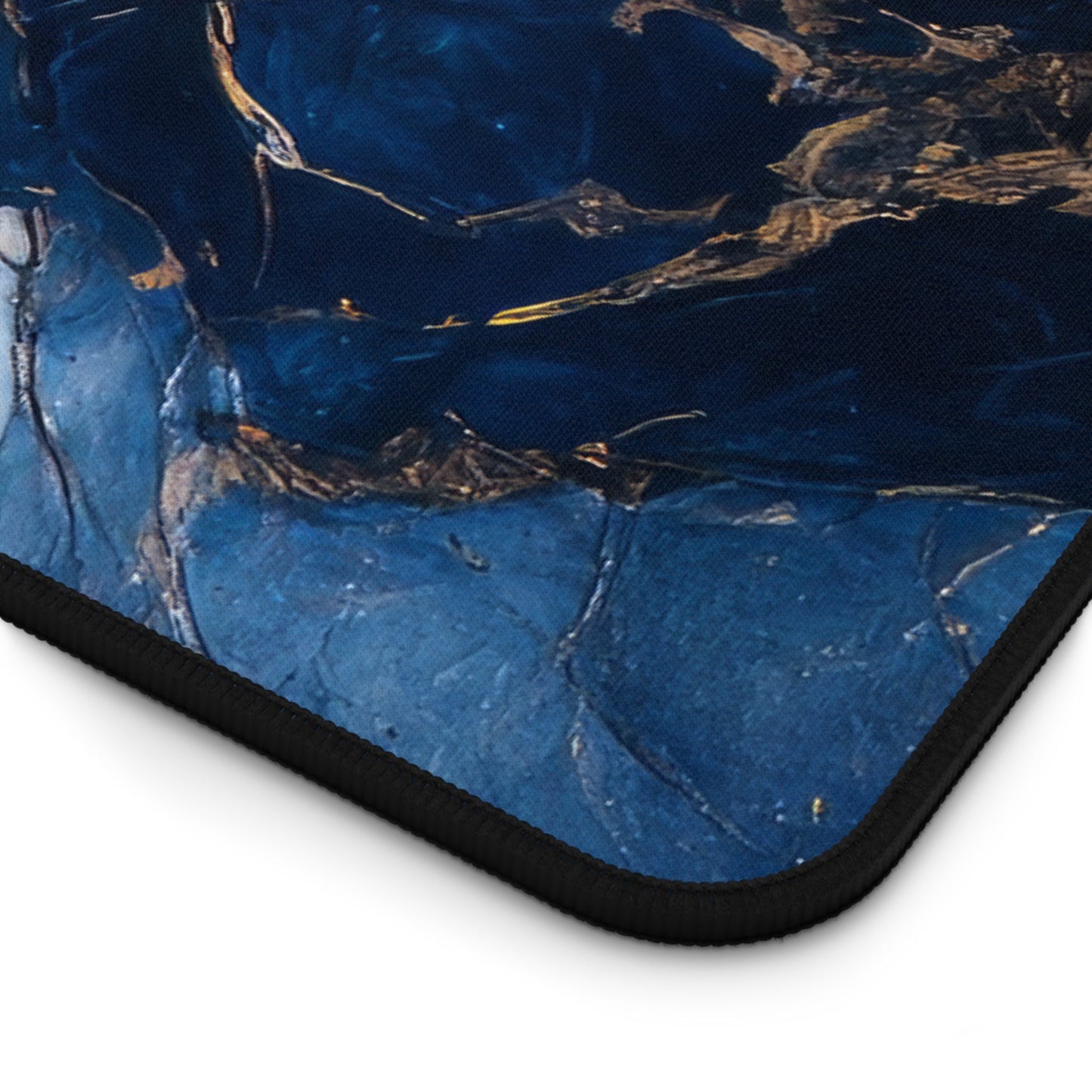 Close-up view of the front of the Blue, Marbled, Gold Accents xxl mouse pad