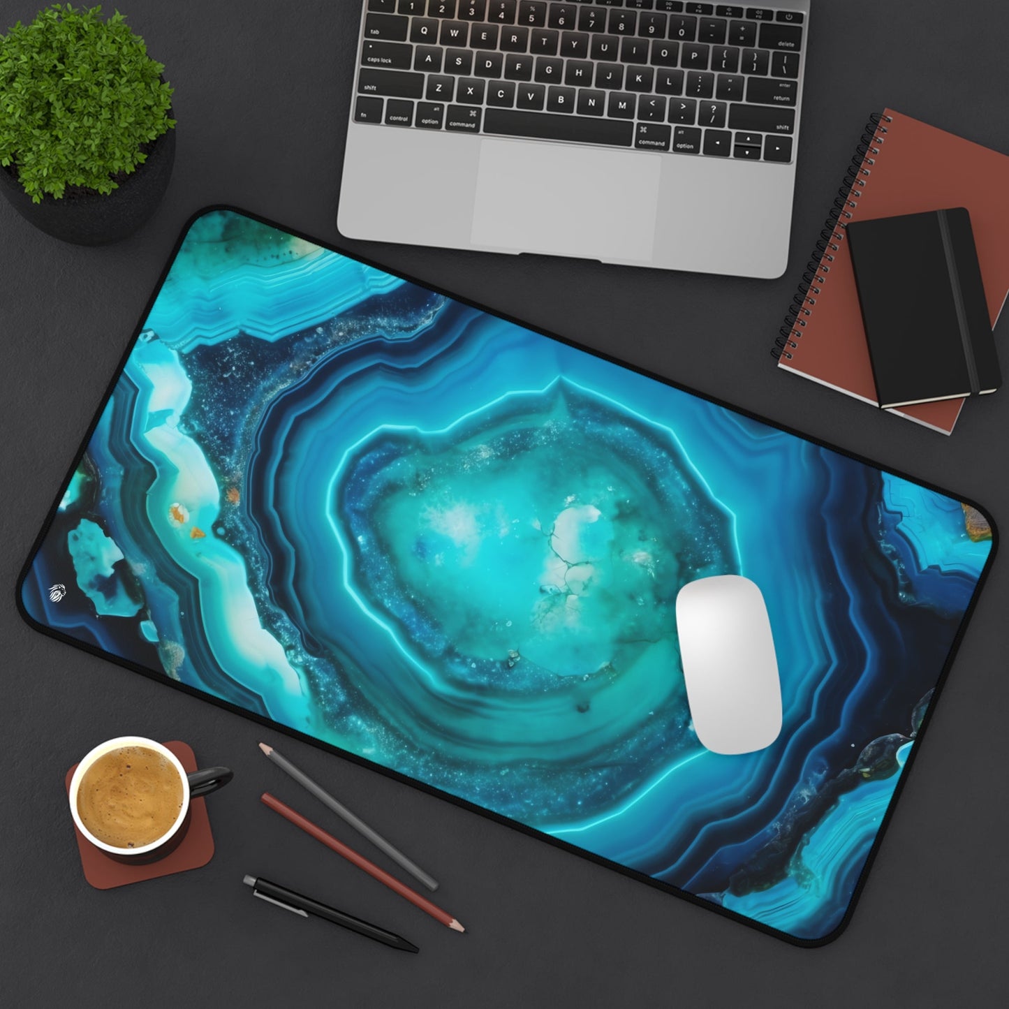 Vibrant Cyan Blue Geode xxl mouse pad of size 12 by 22 inches displayed on a desk