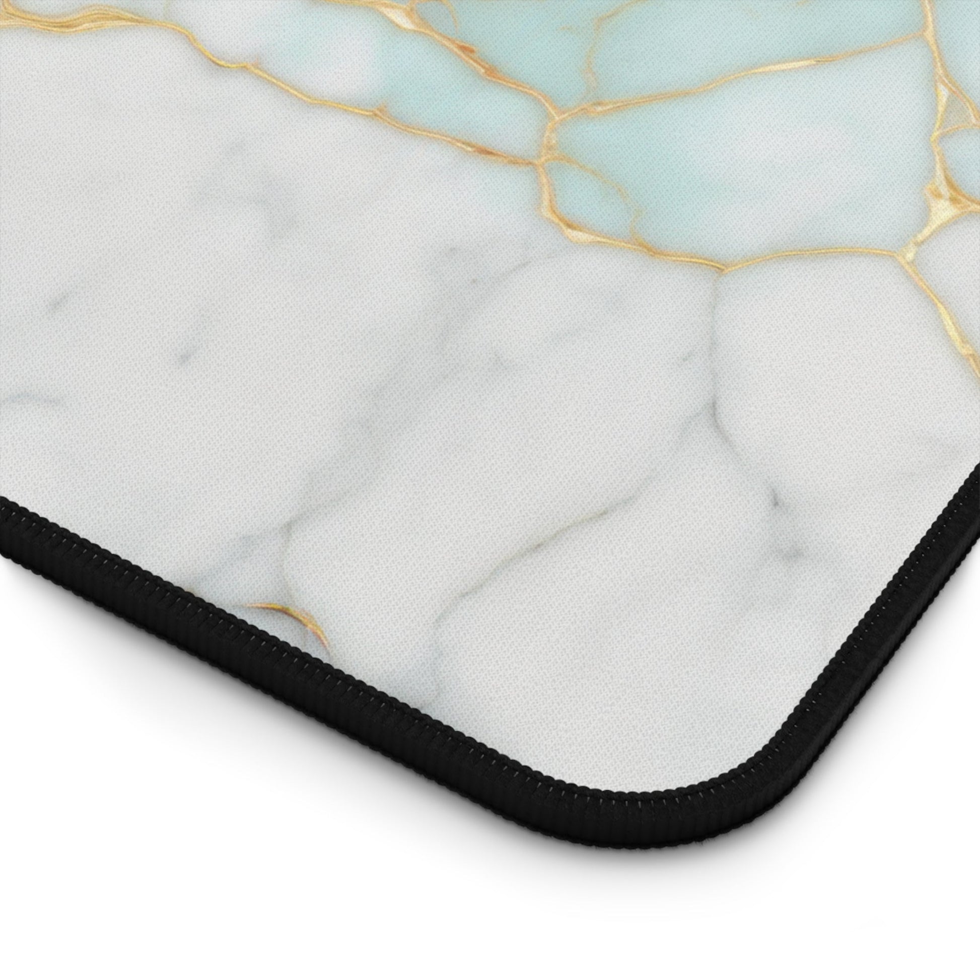 Close-up view of the front of the Aquamarine Marble with Gold Accents xxl mouse pad