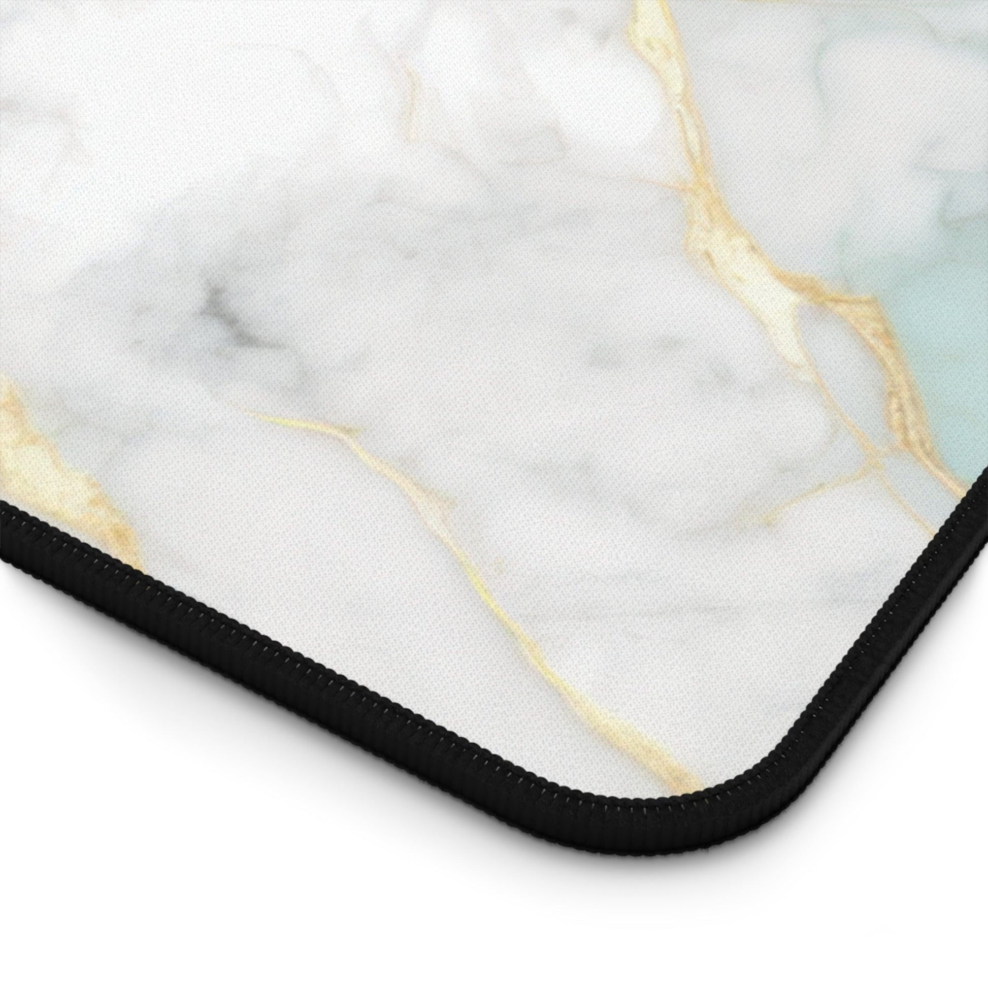 Close-up view of the front of the Aquamarine Marble with Gold Accents xxl mouse pad