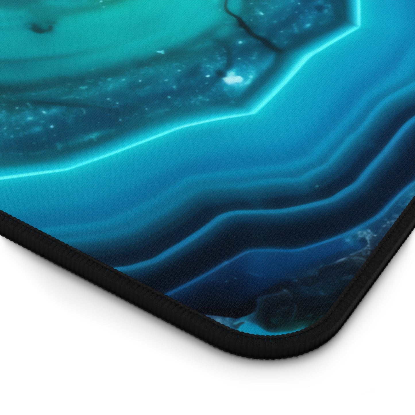 Close-up view of the front of the Vibrant Cyan Blue Geode xxl mouse pad