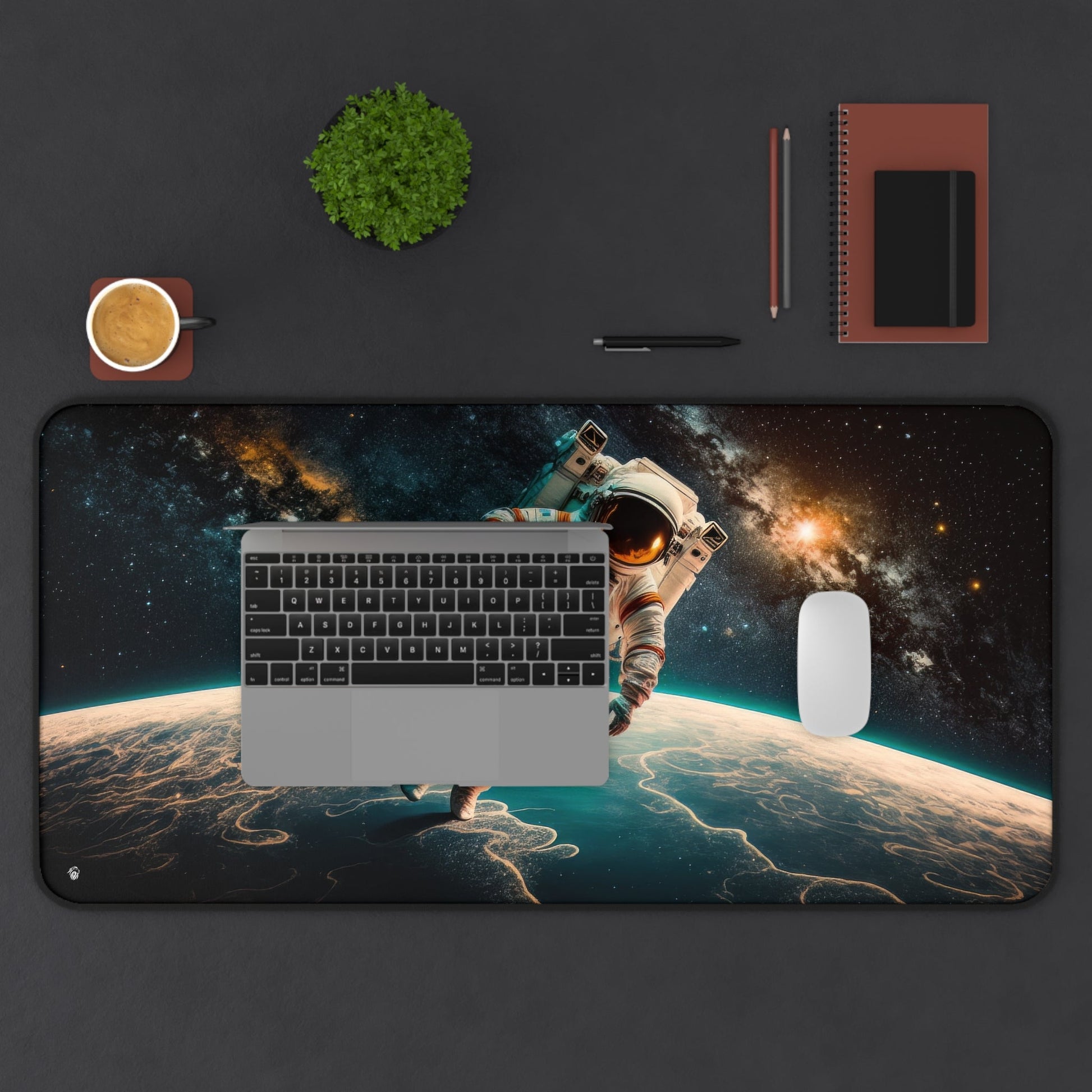 Astronaut in Space xxl mouse pad of size 15 by 31 inches displayed on a desk