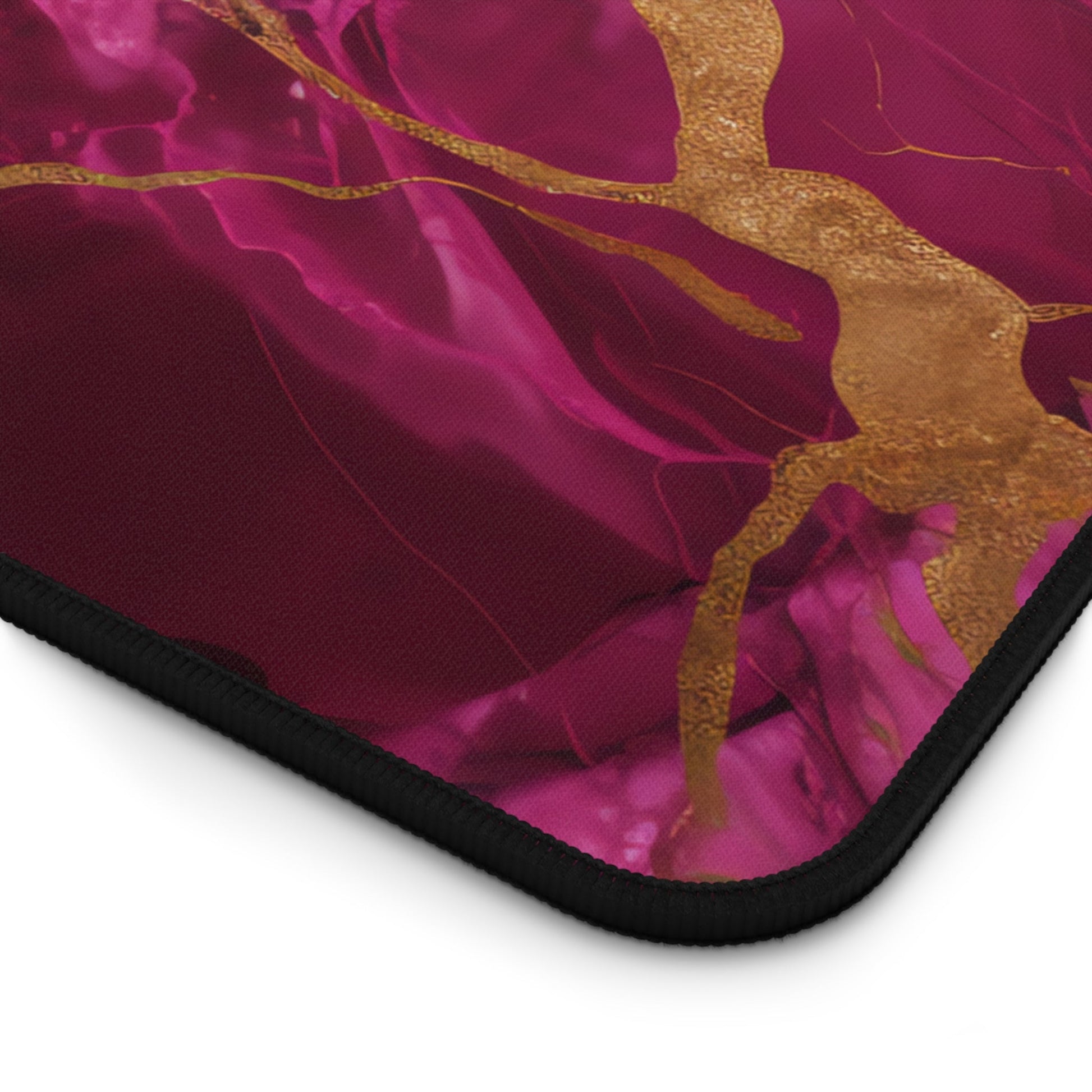 Close-up view of the front of the Fuchsia Marble with Gold Accents xxl mouse pad