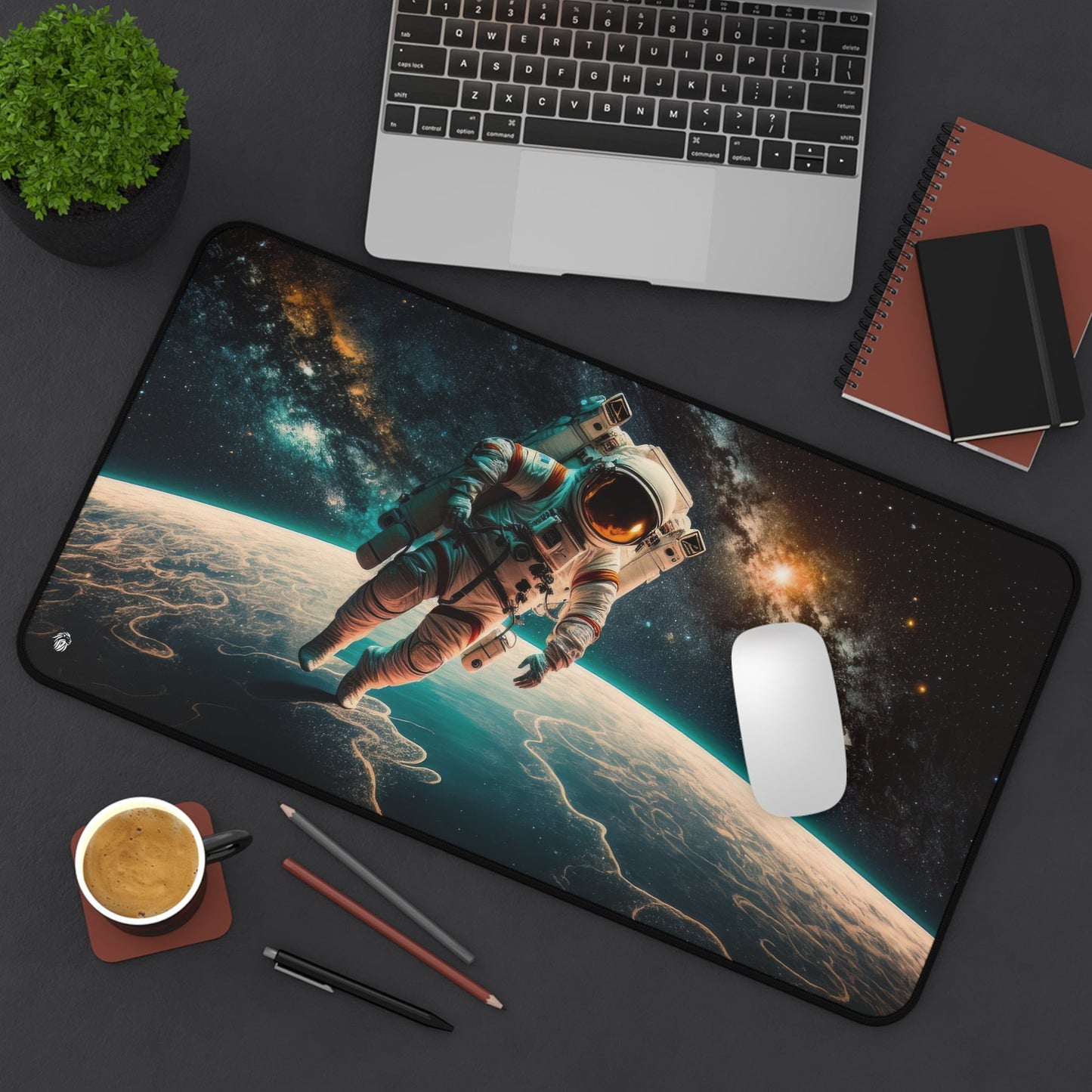 Astronaut in Space xxl mouse pad of size 12 by 22 inches displayed on a desk