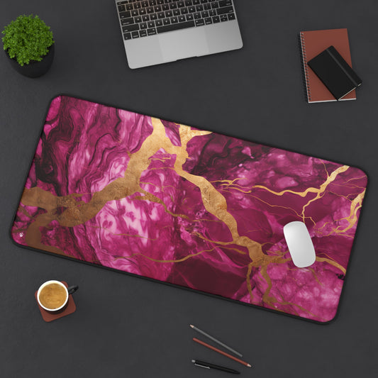 Fuchsia Marble with Gold Accents xxl mouse pad of size 15 by 31 inches displayed on a desk