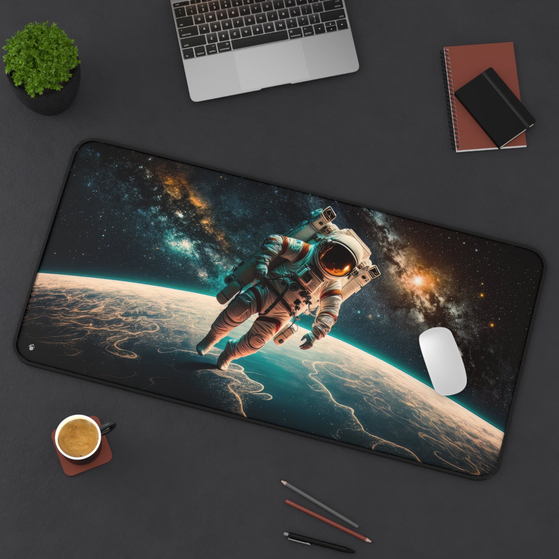 Astronaut in Space xxl mouse pad of size 15 by 31 inches displayed on a desk