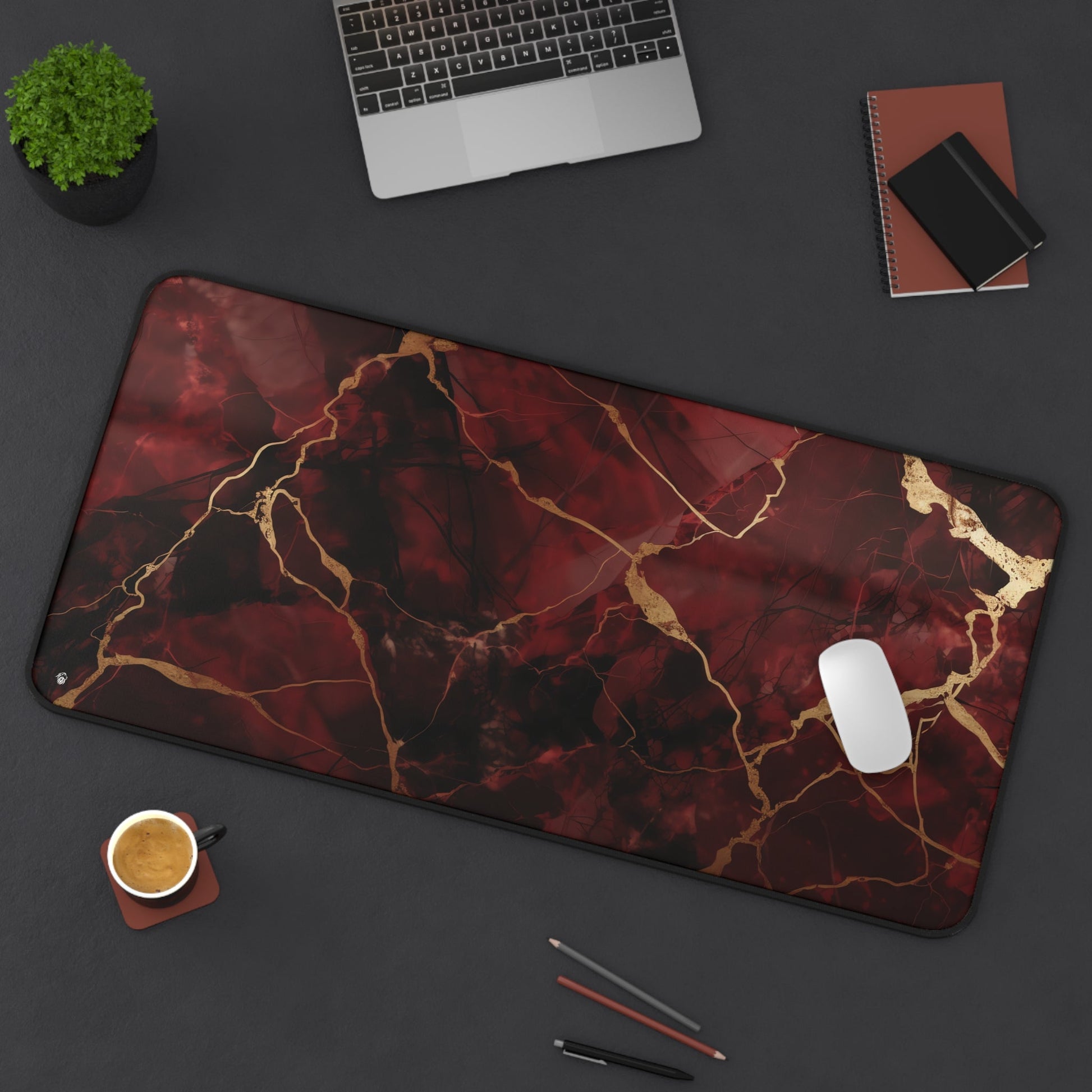 Red Marbled with Gold Streaks xxl mouse pad of size 15 by 31 inches displayed on a desk